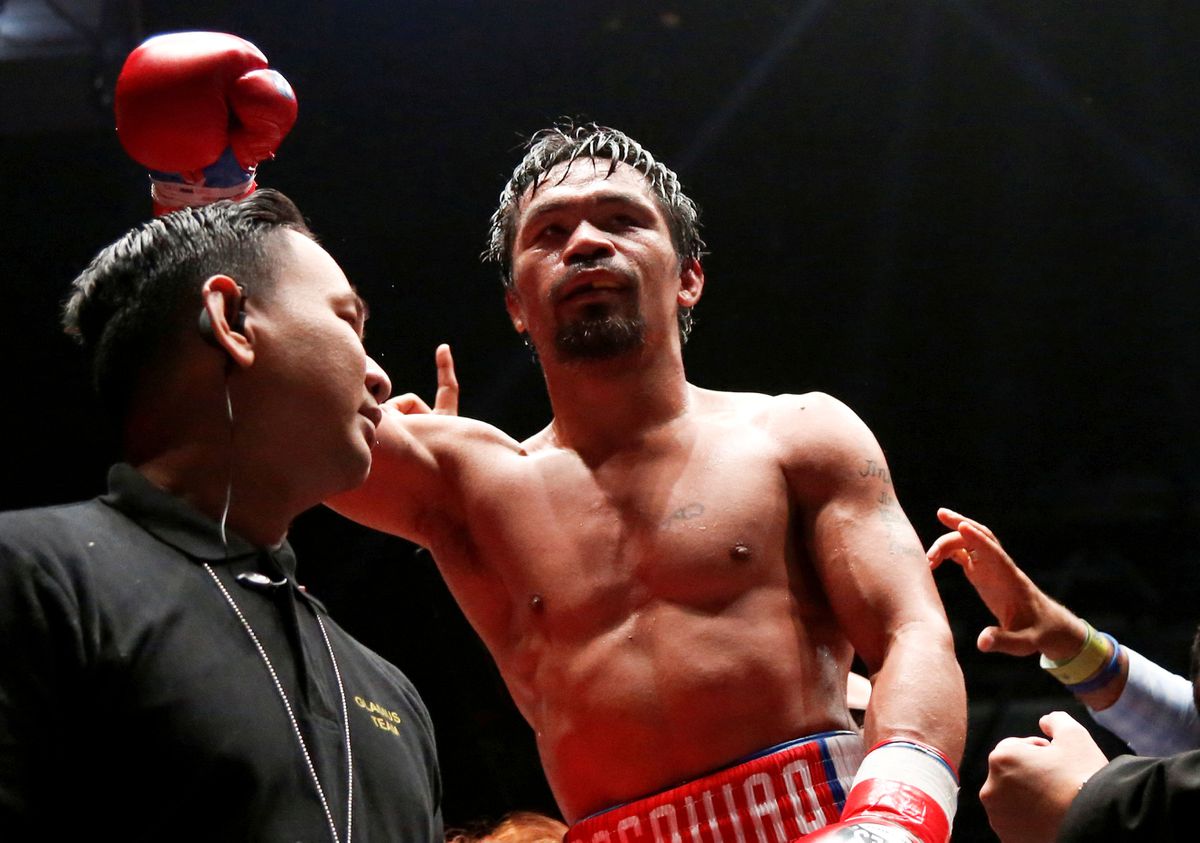 Manny Pacquiao celebrating a knockout win. Credits to: Lai Seng Sin-REUTERS.