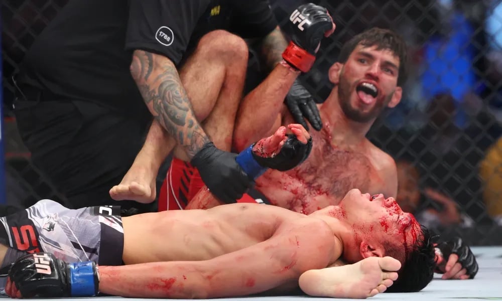  Matt Schnell after triangle choking Sumudaerji. Credits to: Ed Mulholland, USA TODAY Sports.