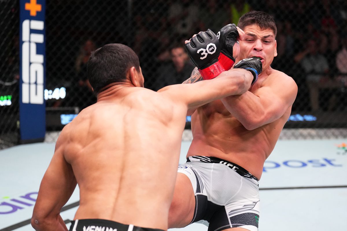 Nursulton Ruziboev flattens Brunno Ferreira with a right hand. Credit: MMA Fighting.