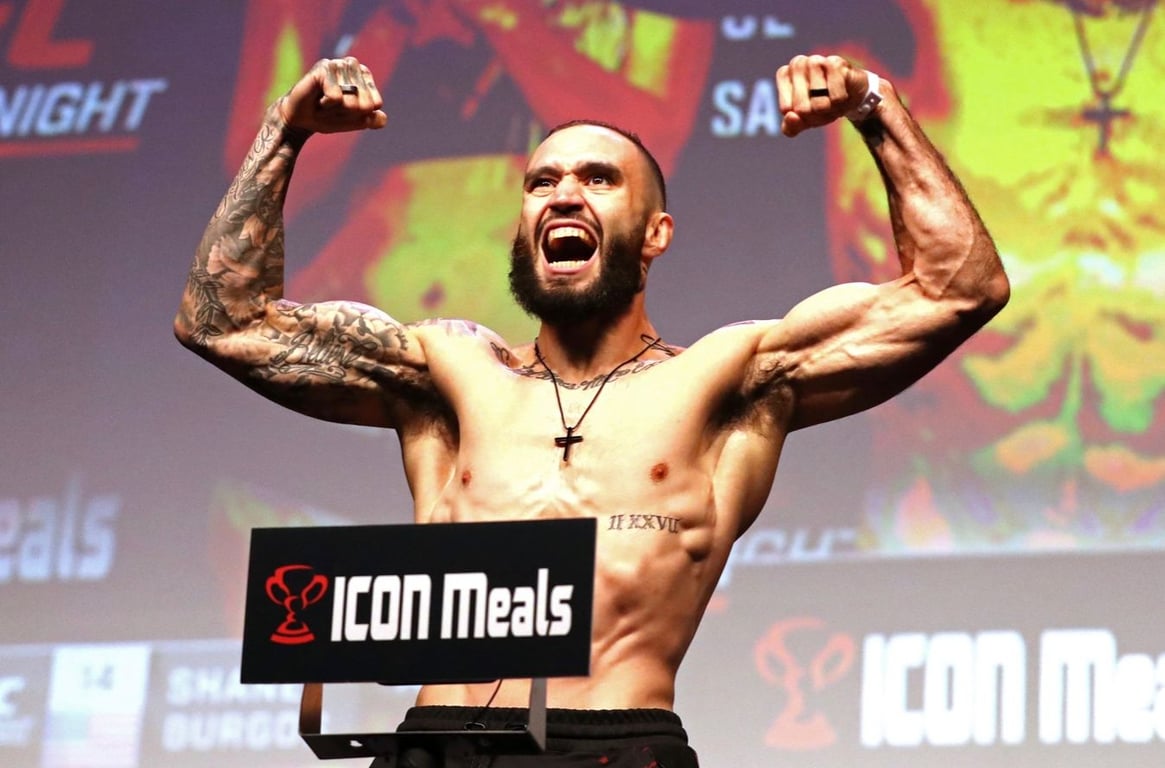 Shane Burgos roars to the crowd. Credits to: AP Photo/Gregory Payan