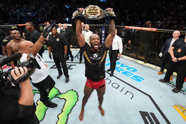 Leon Edwards raising the belt after defeating Kamaru Usman at UFC 278. Credits to: Josh Hedges-Zuffa LLC.
