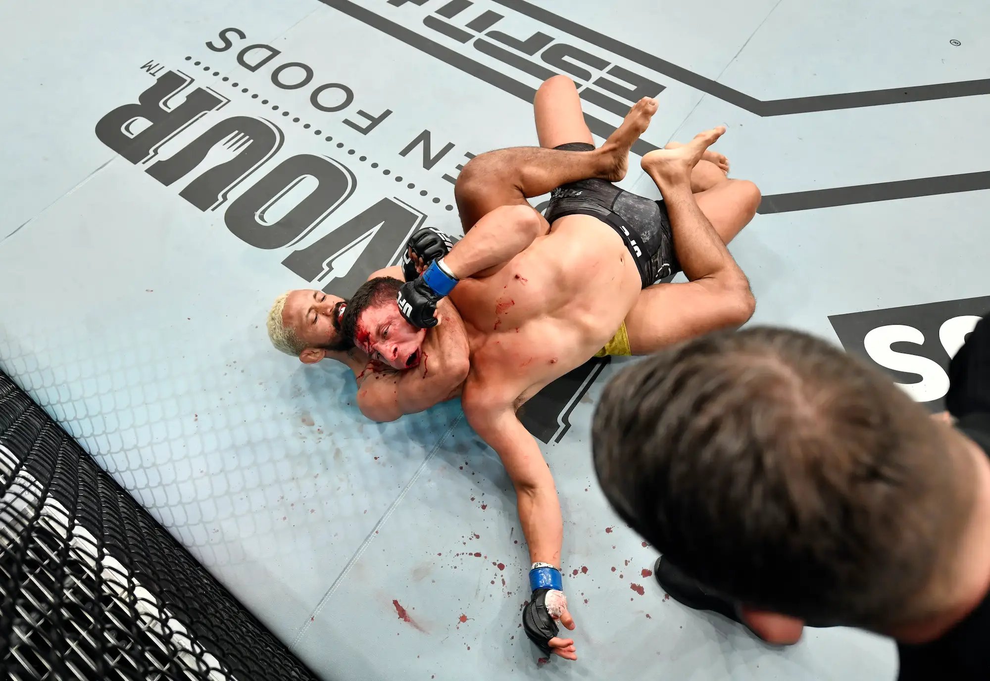 Deiveson Figueiredo submits Joseph Benavidez to become the Flyweight champion. Credit: Jeff Bottari/Zuffa LLC