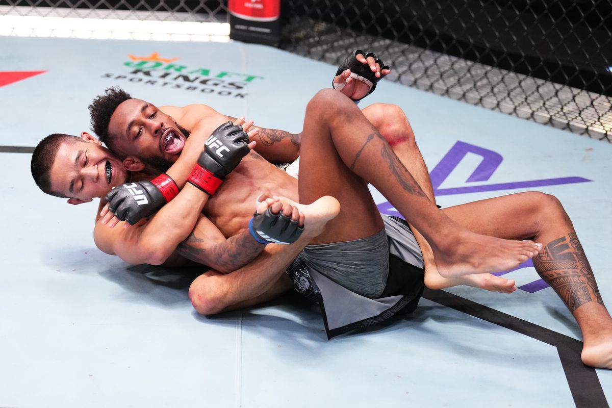 Asu Almabayev skillfully applies a rear-naked choke to Jose Johnson.