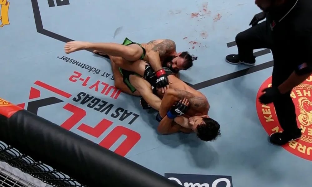 Claudio Puelles finishing Clay Guida with a kneebar. (Jeff Bottari/Getty Images)