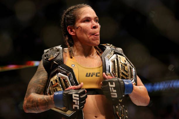 Amanda Nunes with her two championship belts after UFC 277. Photo by Carmen Mandato, Getty Images.