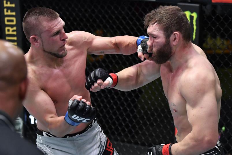 Dustin Jacoby blasts Ion Cutelaba with a left hand. Credit: Zuffa LLC.