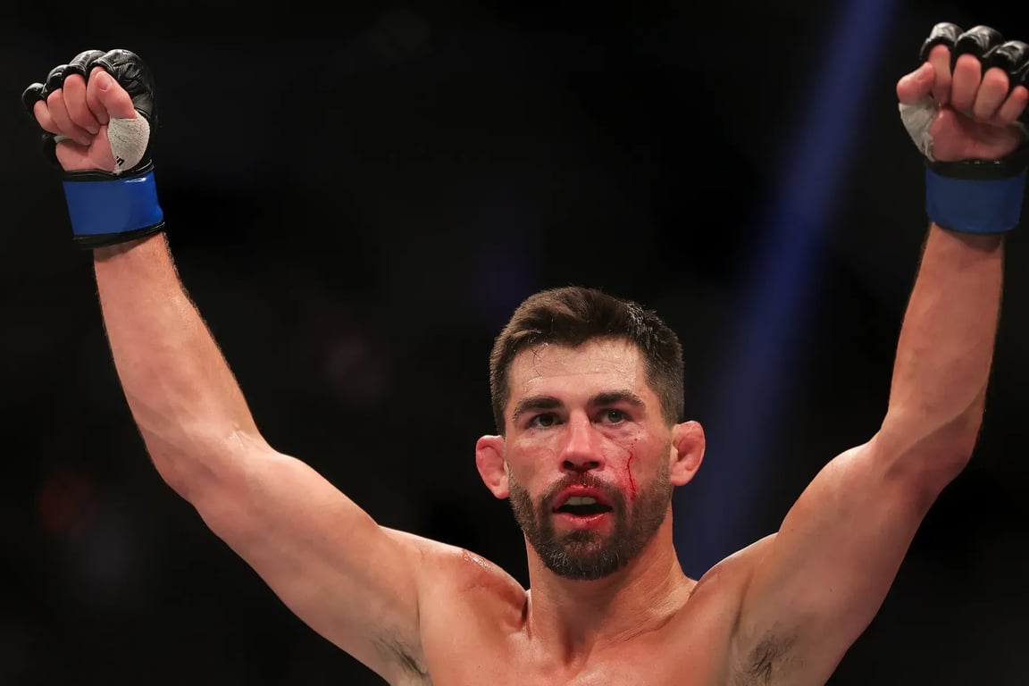 Dominick Cruz celebrates after defeating Pedro Munhoz at UFC 269. Credits to: Carmen Mandato-Zuffa LLC