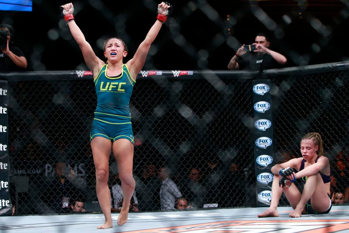 Carla Esparza celebrating her win against Rose Namajunas. (Esther Lin)