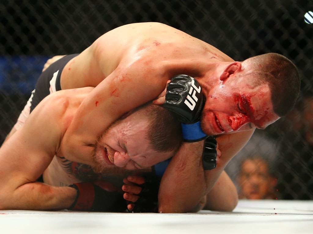 Nate Diaz chokes out Conor McGregor at UFC 196. Credits to: Christian Petersen/Zuffa LLC