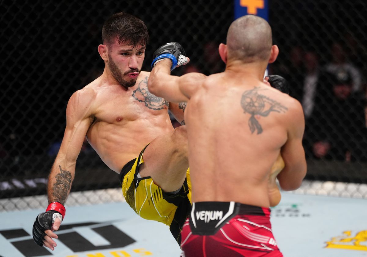 Matheus Nicolau throws a front kick at Matt Schnell. Credit: Zuffa LLC.