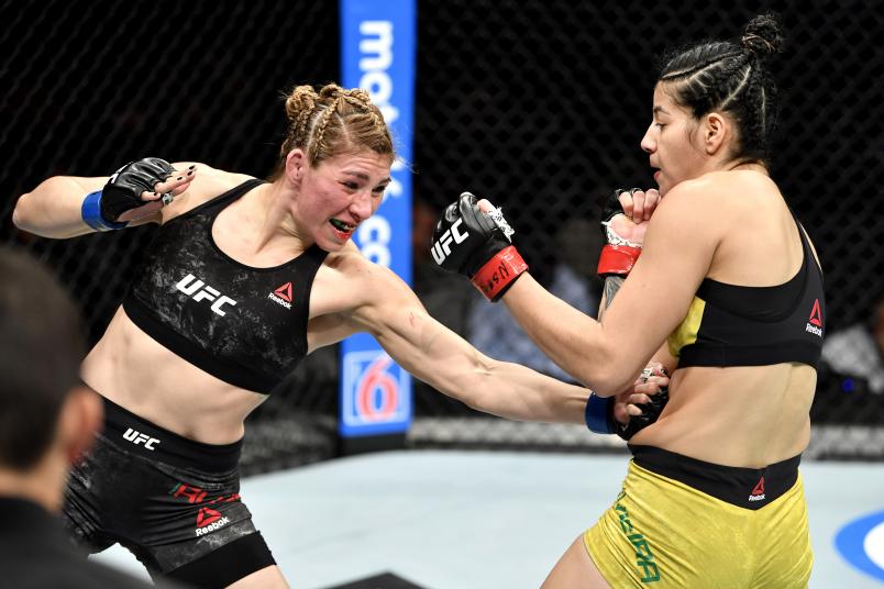 Irene Aldana lands a body shot on Ketlen Vieira. Credit to: Zuffa LLC.