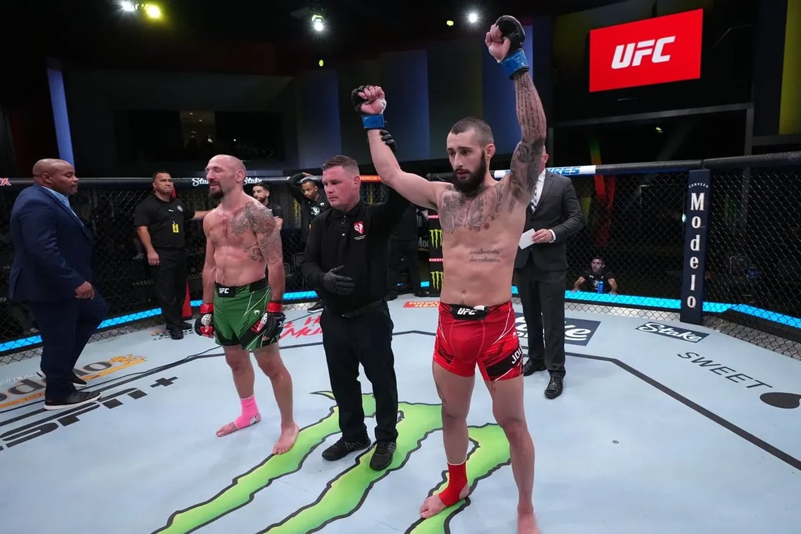 Charles Jourdain gets his hand raised against Lando Vannata. (Jeff Bottari/Getty Images)