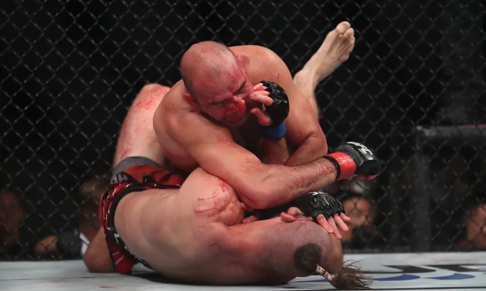 Jiří Procházka took heavy ground and pound from Glover Texieira . Credits to: Paul Miller, USA TODAY Sports.