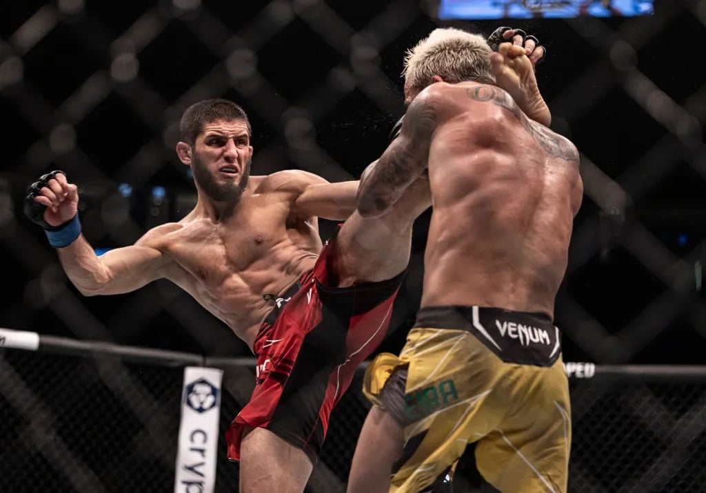 Islam Makhachev facing Charles Oliveira at UFC 280. Credits to: Craig Kidwell - USA TODAY Sports.