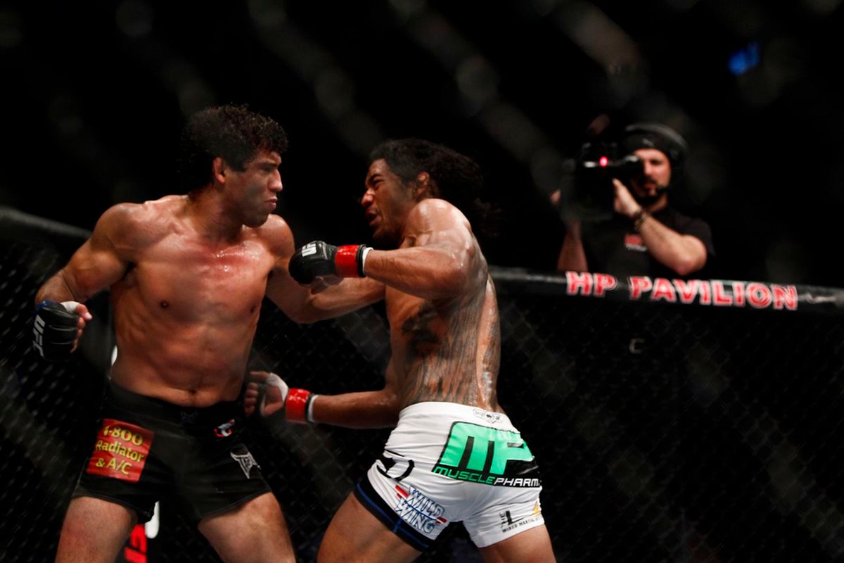 Benson Henderson and Gilbert Melendez exchange blows. Credit: MMA Fighting.