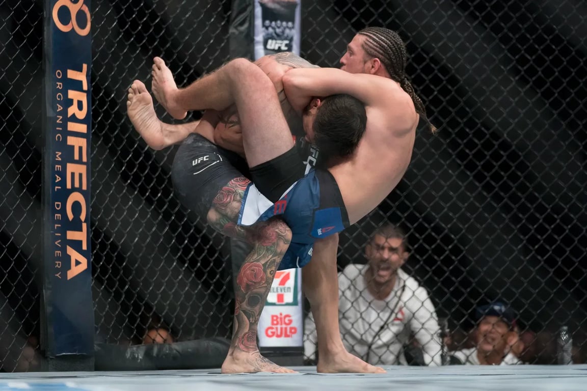 Brian Ortega wraps up a guillotine choke against Cub Swanson in his first ever main event. Credits to: Kyle Terada-USA TODAY Sports