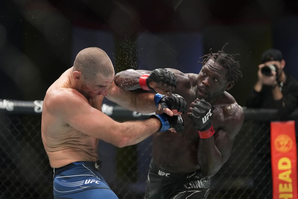 Jared Cannonier busts up Sean Strickland with a right hook. Credit: DraftKings Network.