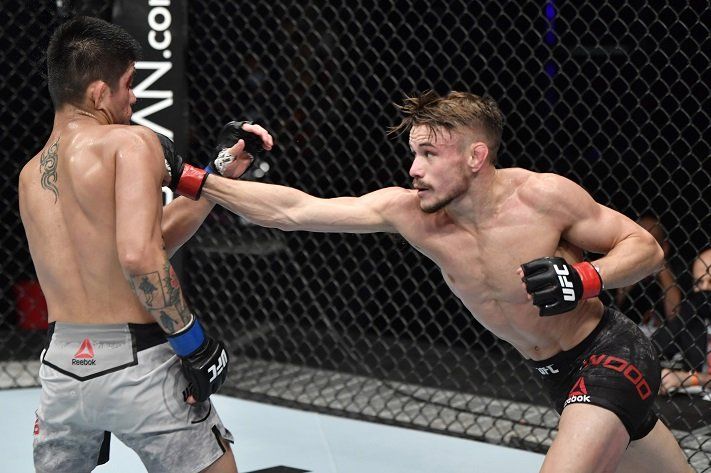 Nathaniel Wood outstricking John Castañeda. Credits to: Jeff Botari - Zuffa LLC.