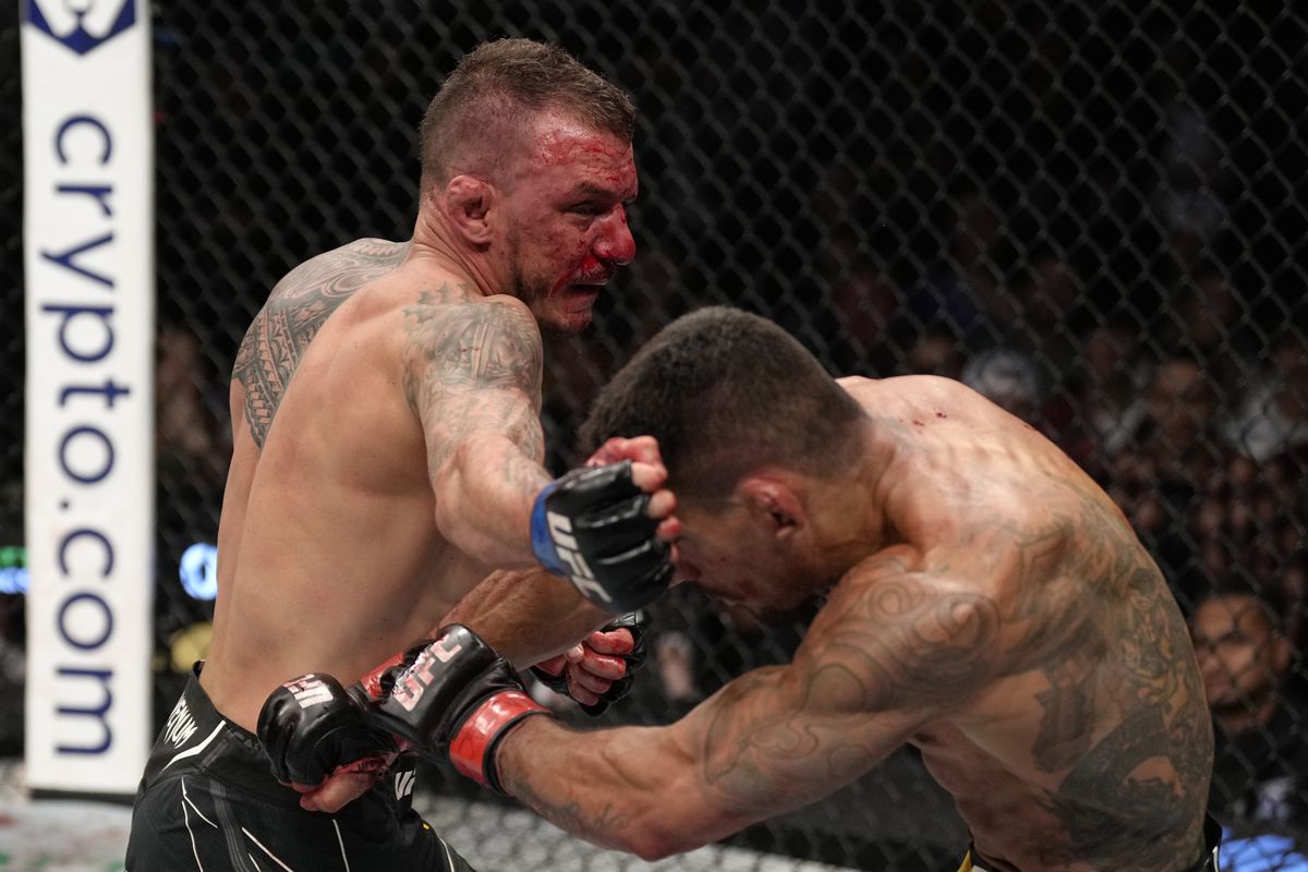 Renato Moicano lands a right hook on Rafael Dos Anjos. Credit: MMA Mania.