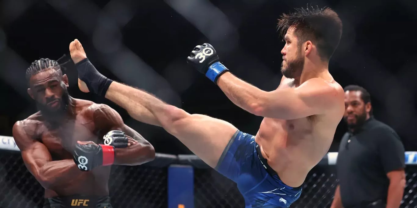 Henry Cejudo landing a headkick on Aljamain Sterling at UFC 298. Credits to: Ed Mulholland - USA TODAY Sports.