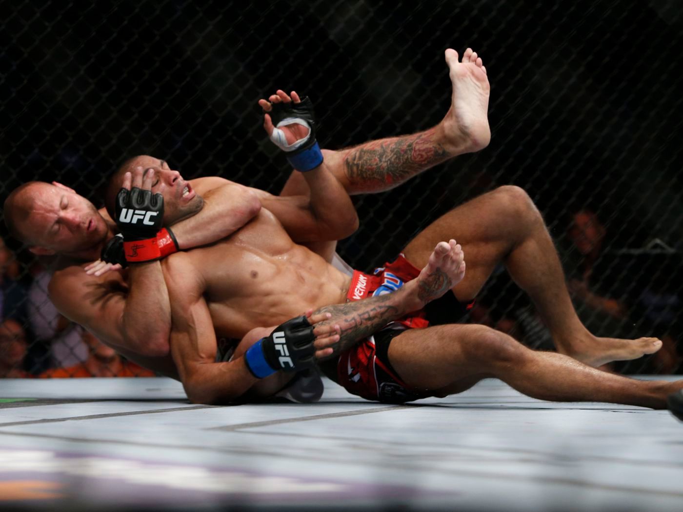 Cowboy Cerrone chokes out Edson Barboza. Credit: Zuffa LLC.