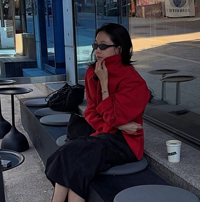 Son Na-eun wearing a red work jacket