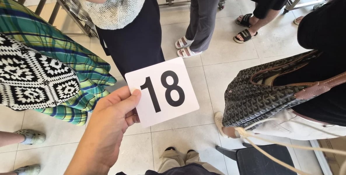 10:03 a.m. arrival time, just three minutes after opening, and received waiting number 18