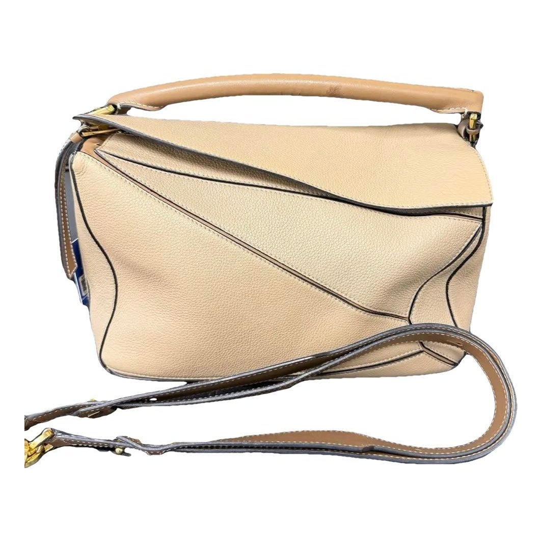 Puzzle leather handbag