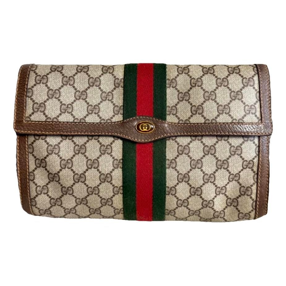 Ophidia patent leather clutch bag