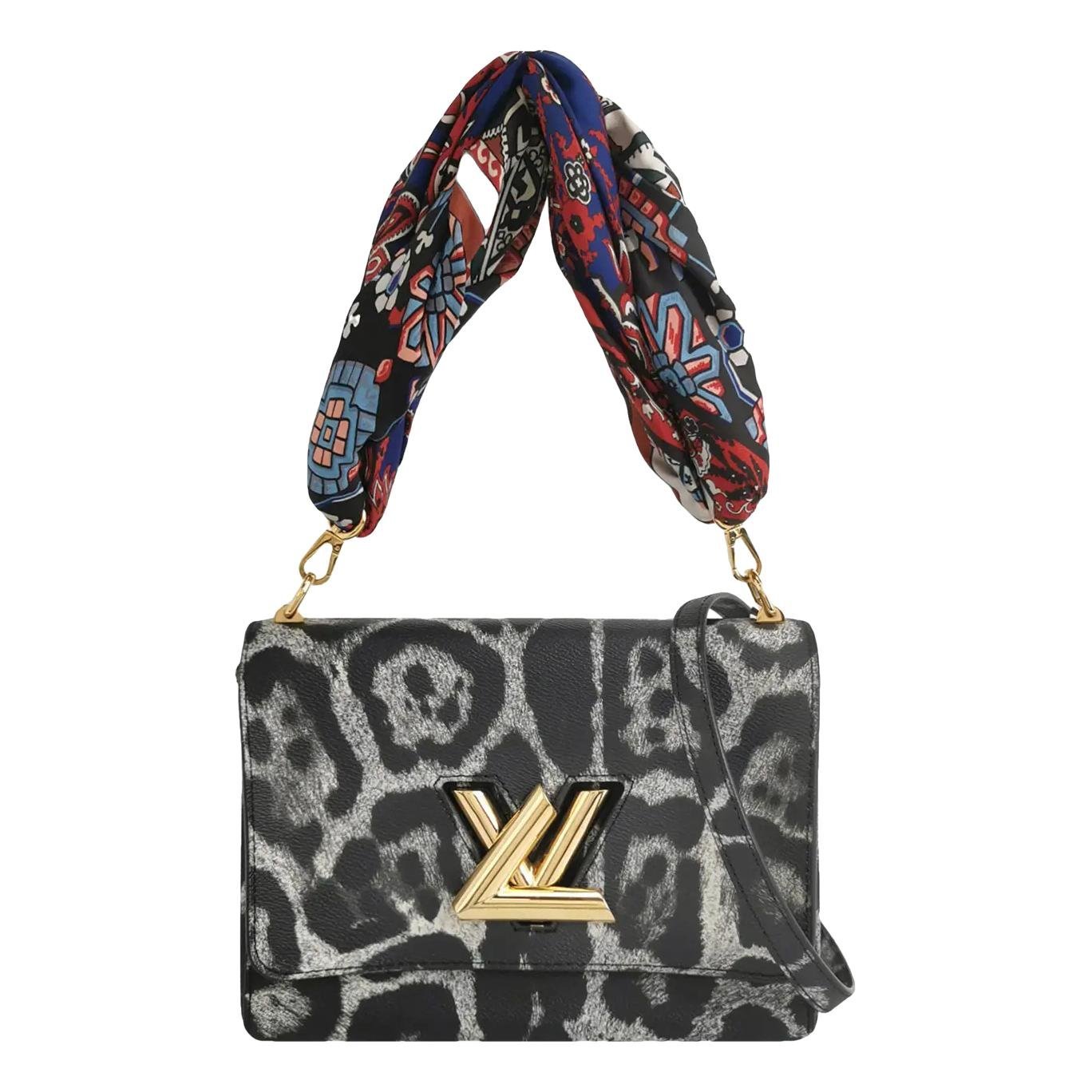 Twist vinyl crossbody bag