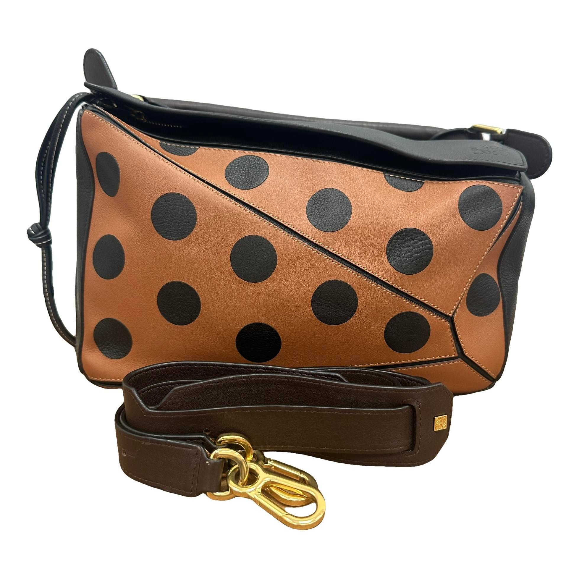 Puzzle leather handbag