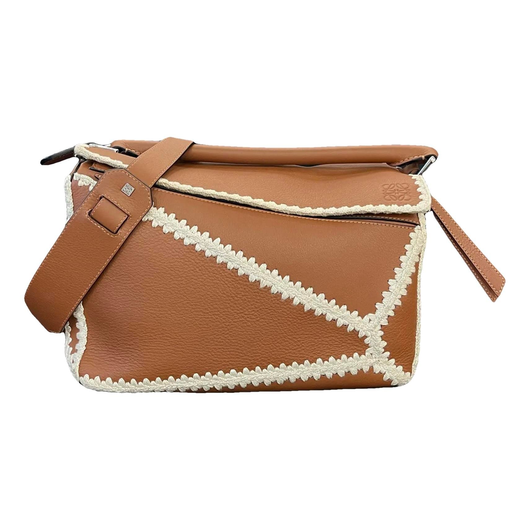 Puzzle leather handbag