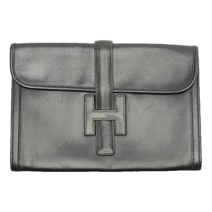 Jige leather clutch bag