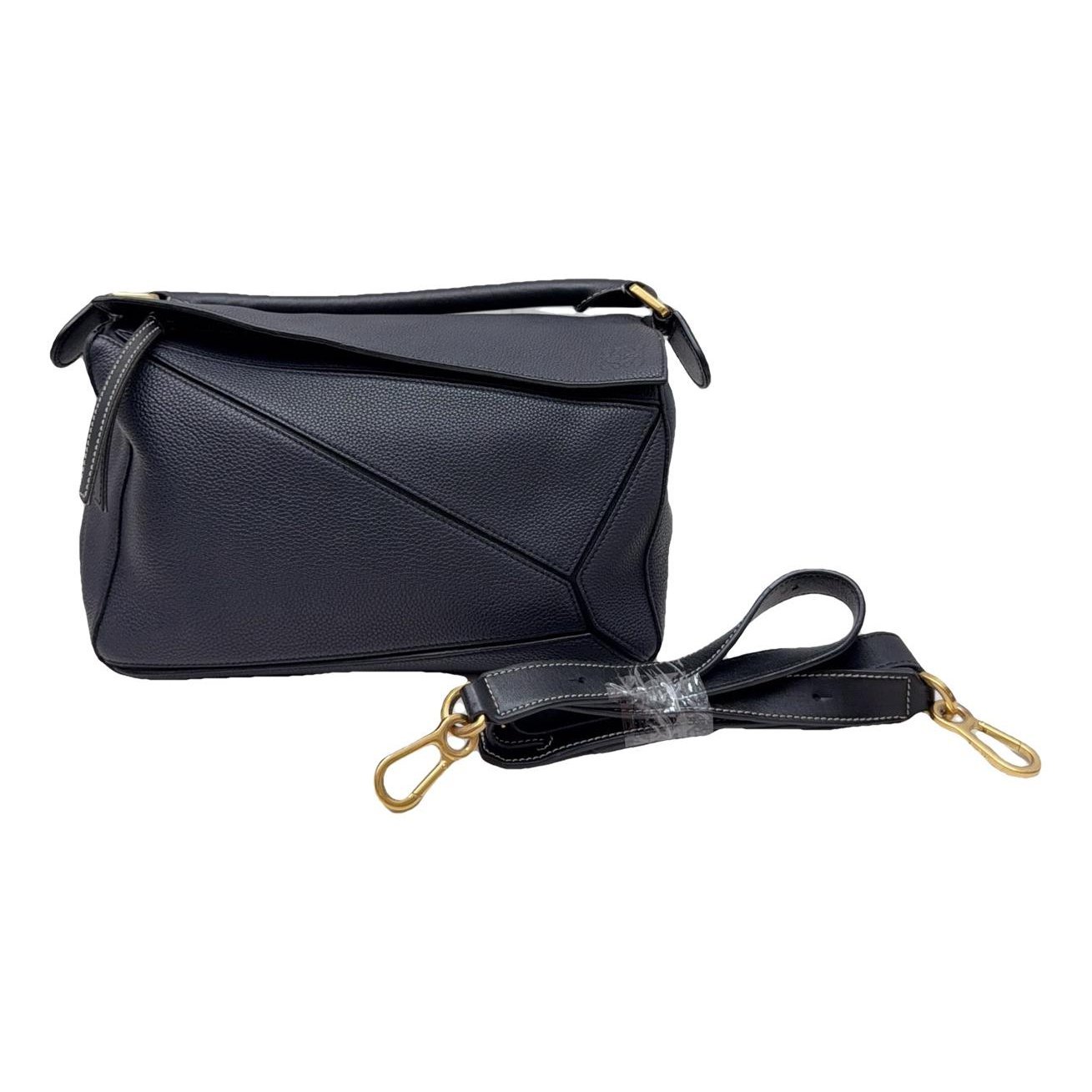 Puzzle leather handbag