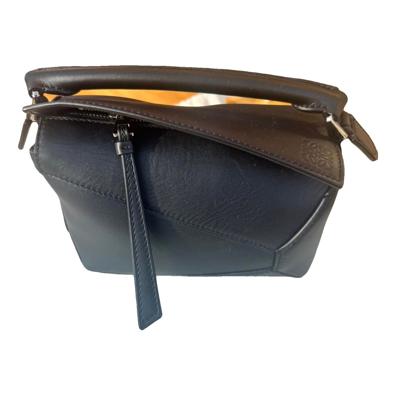 Puzzle leather handbag