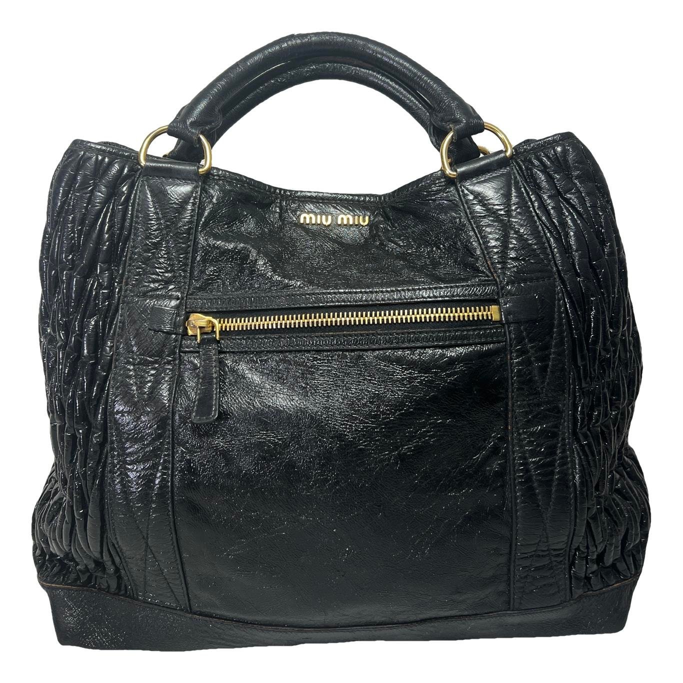 Matelassé vinyl handbag