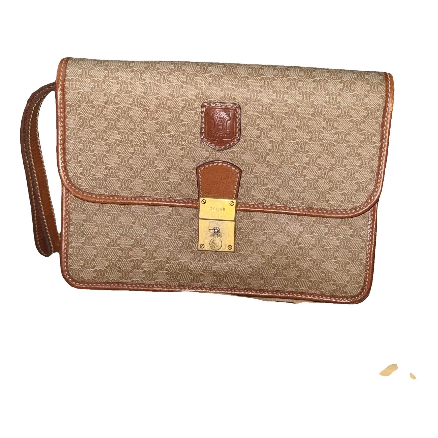 Triomphe Vintage leather clutch bag