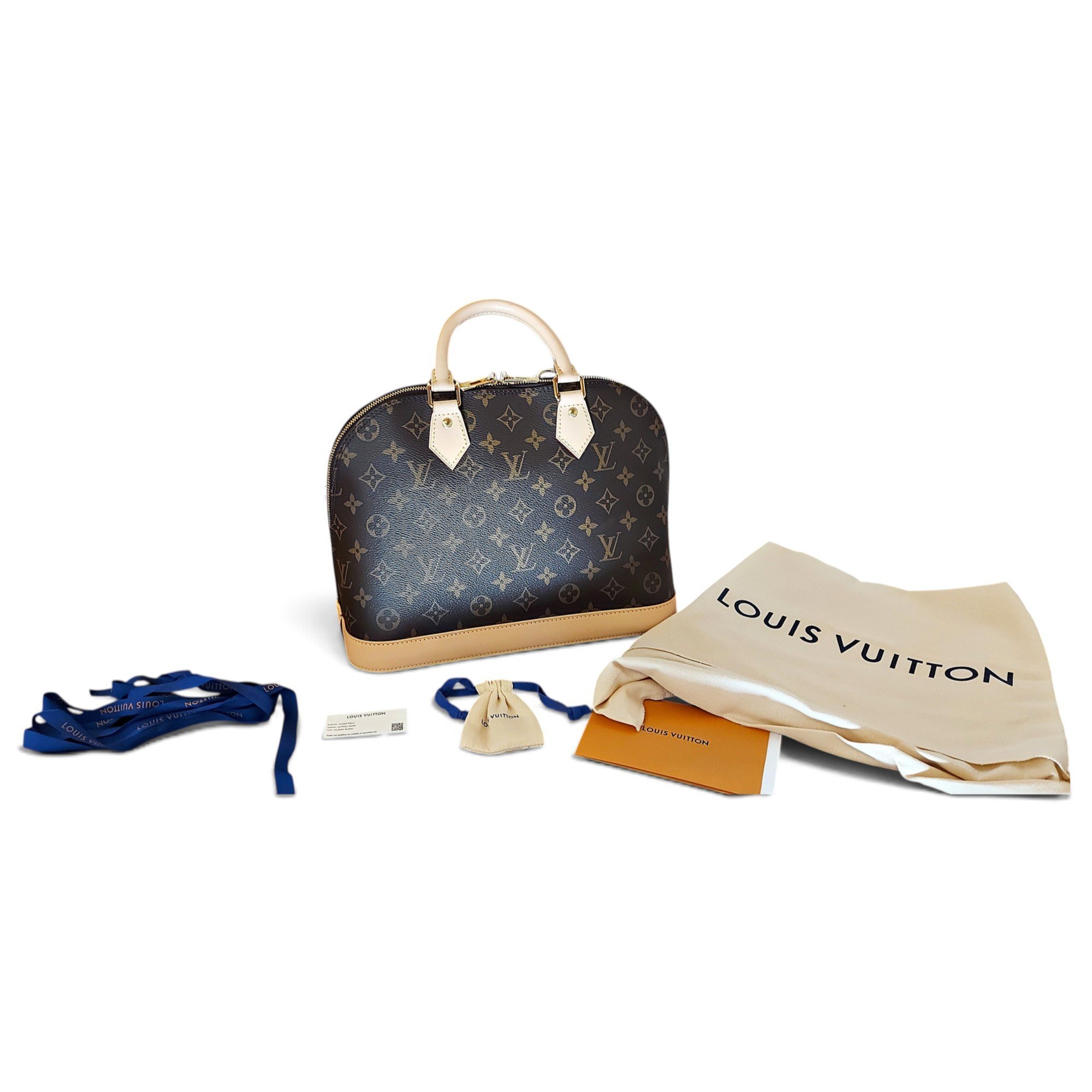Louis Vuitton Alma cloth handbag
