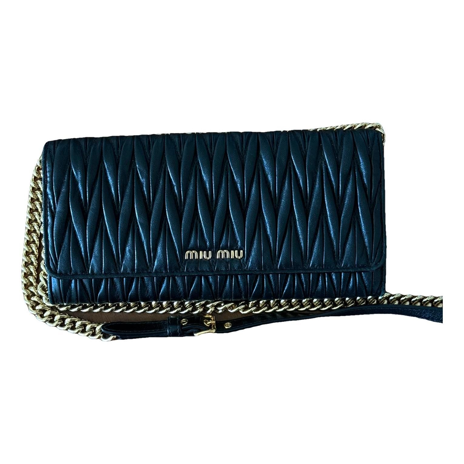 Matelassé leather clutch bag