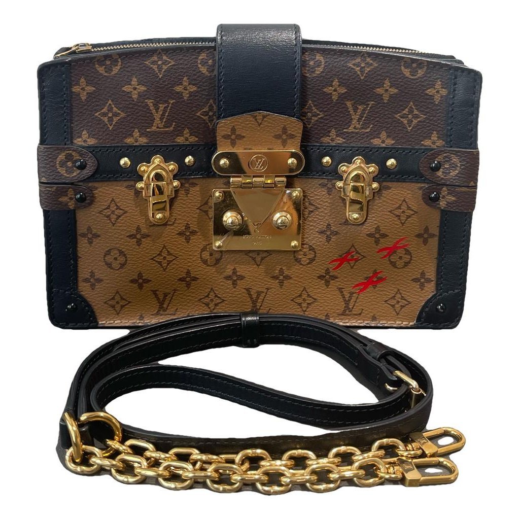 Pochette Trunk leather handbag