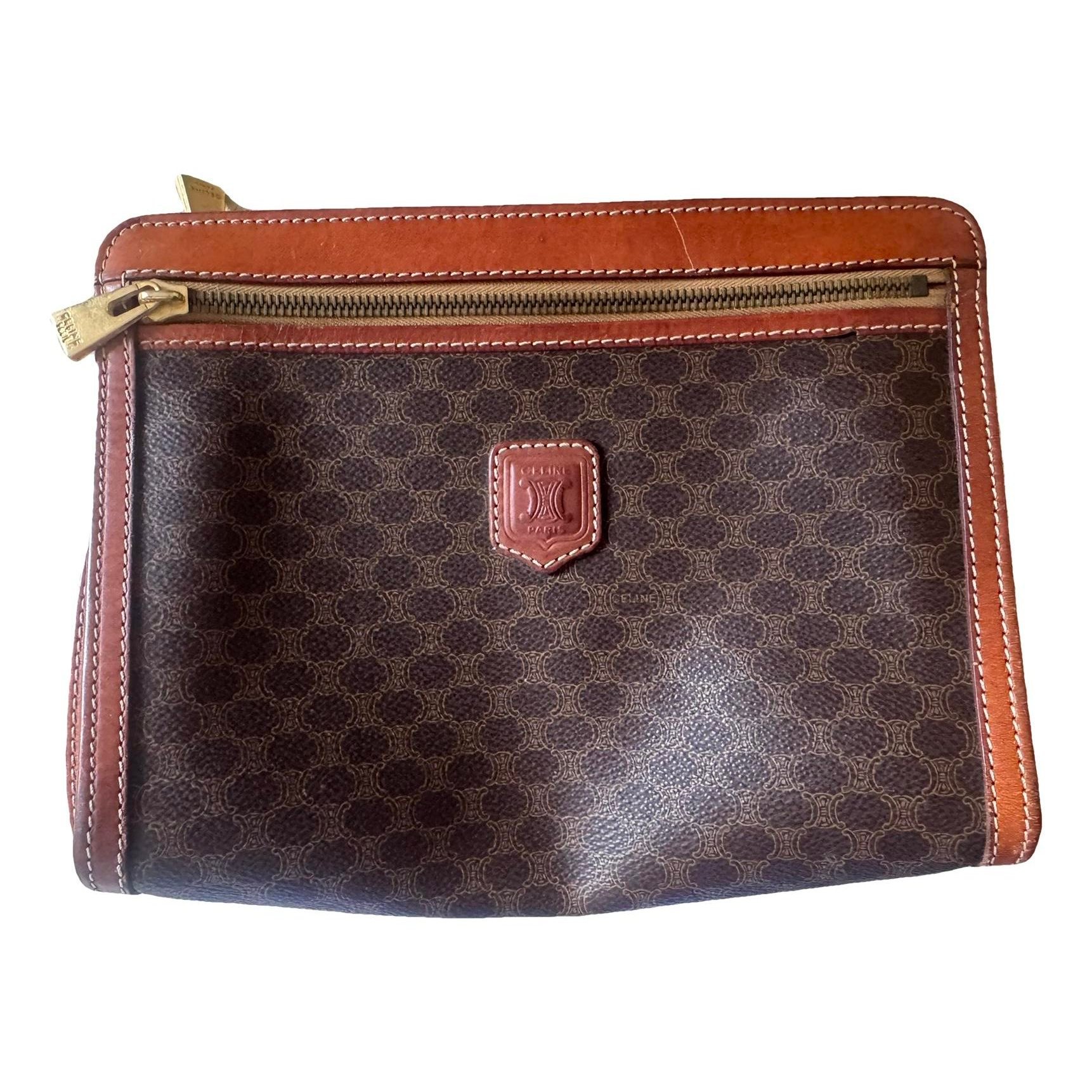 Triomphe Vintage leather clutch bag