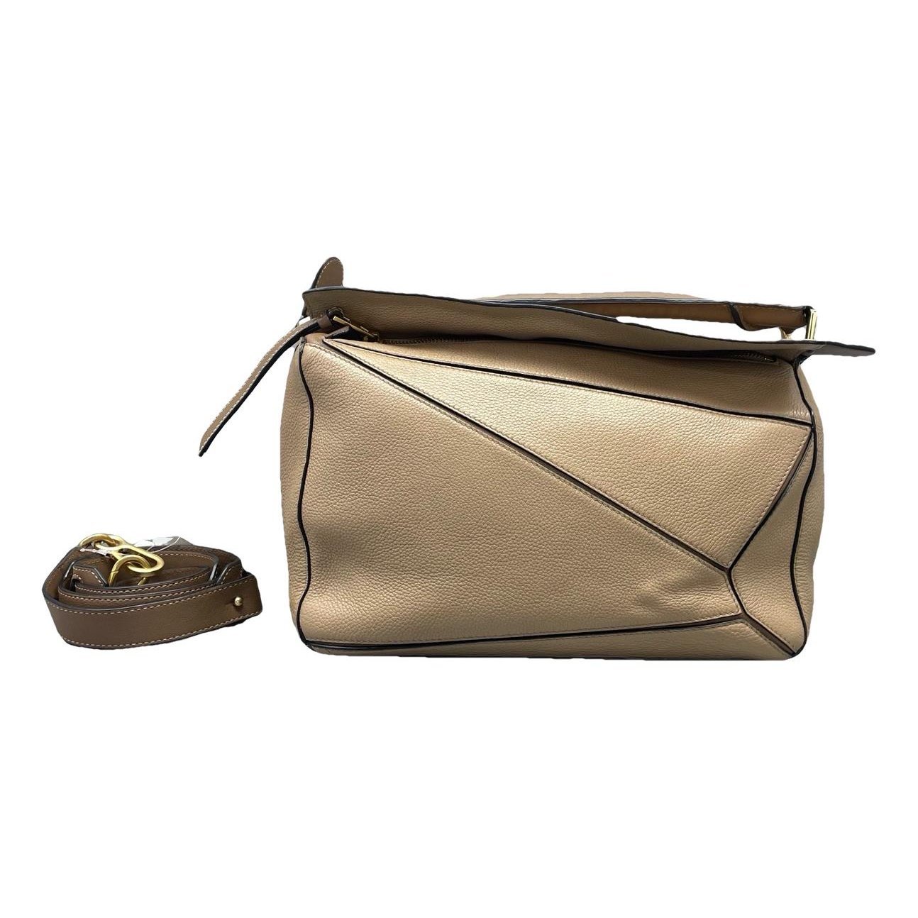 Puzzle leather handbag