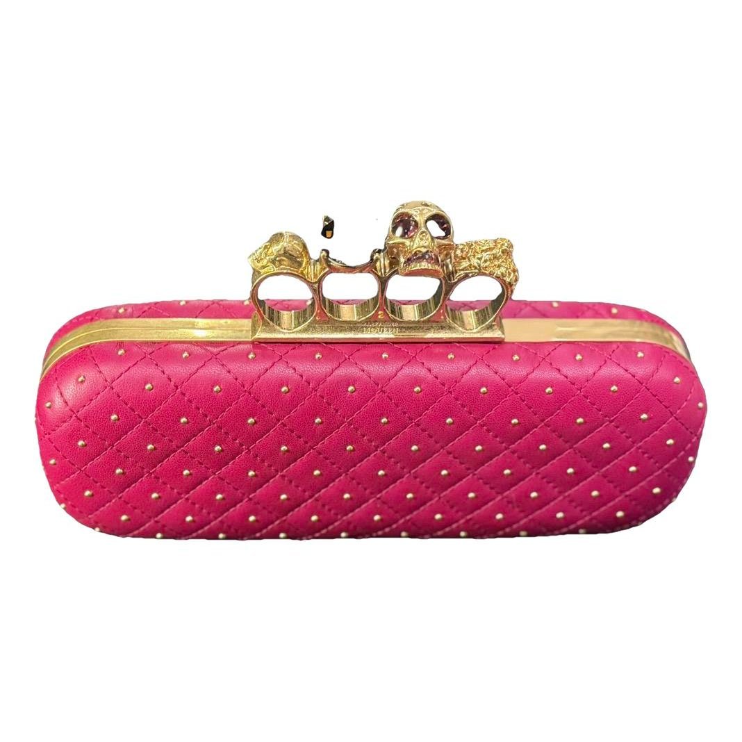 Knuckle leather clutch bag