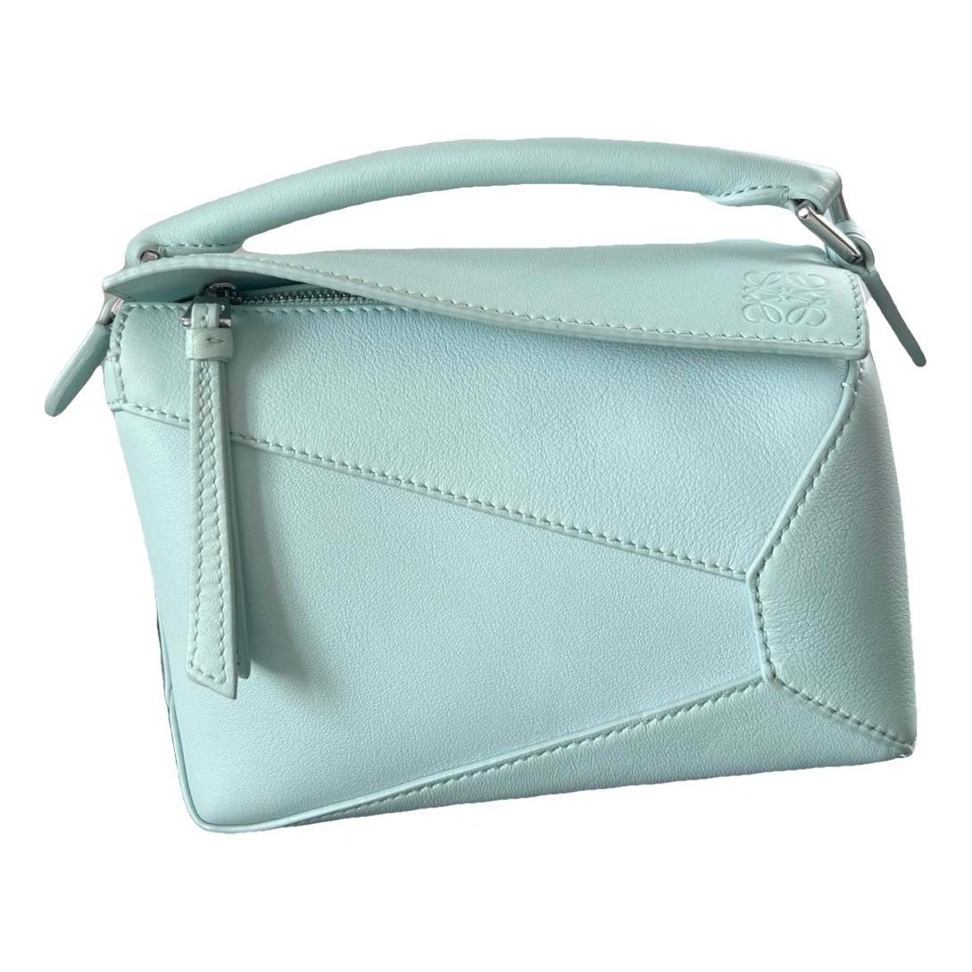 Puzzle leather handbag