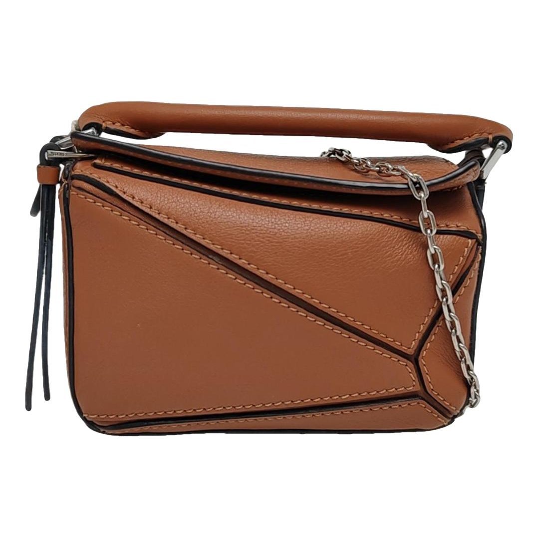 Puzzle leather handbag