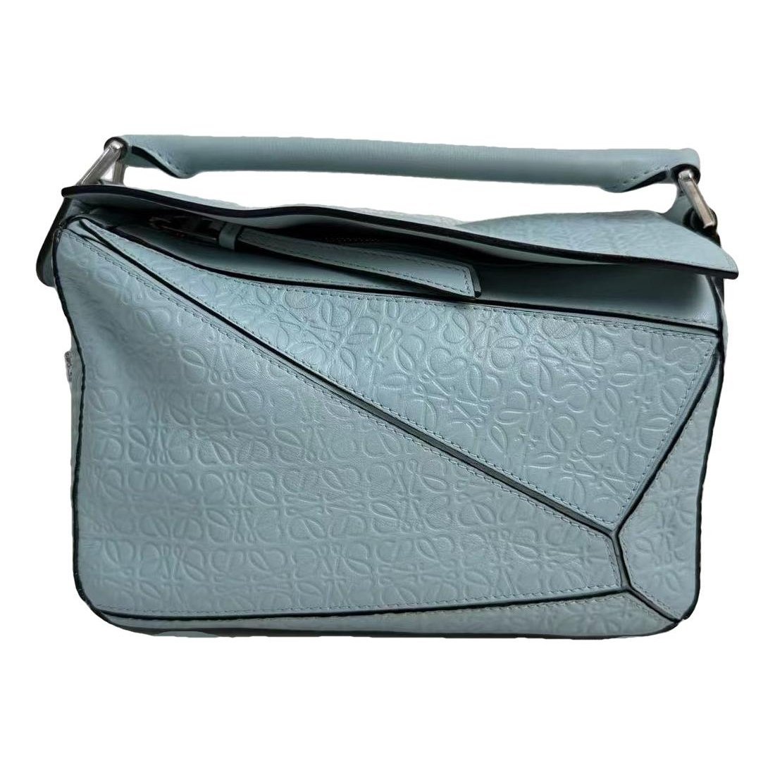 Puzzle leather handbag