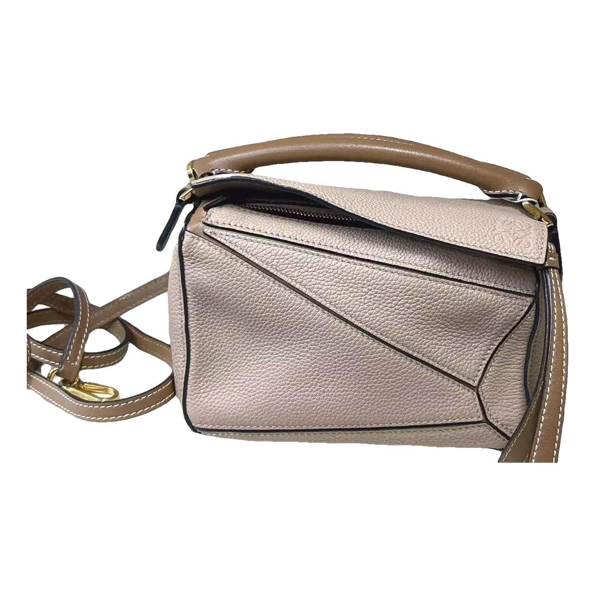 Puzzle leather handbag