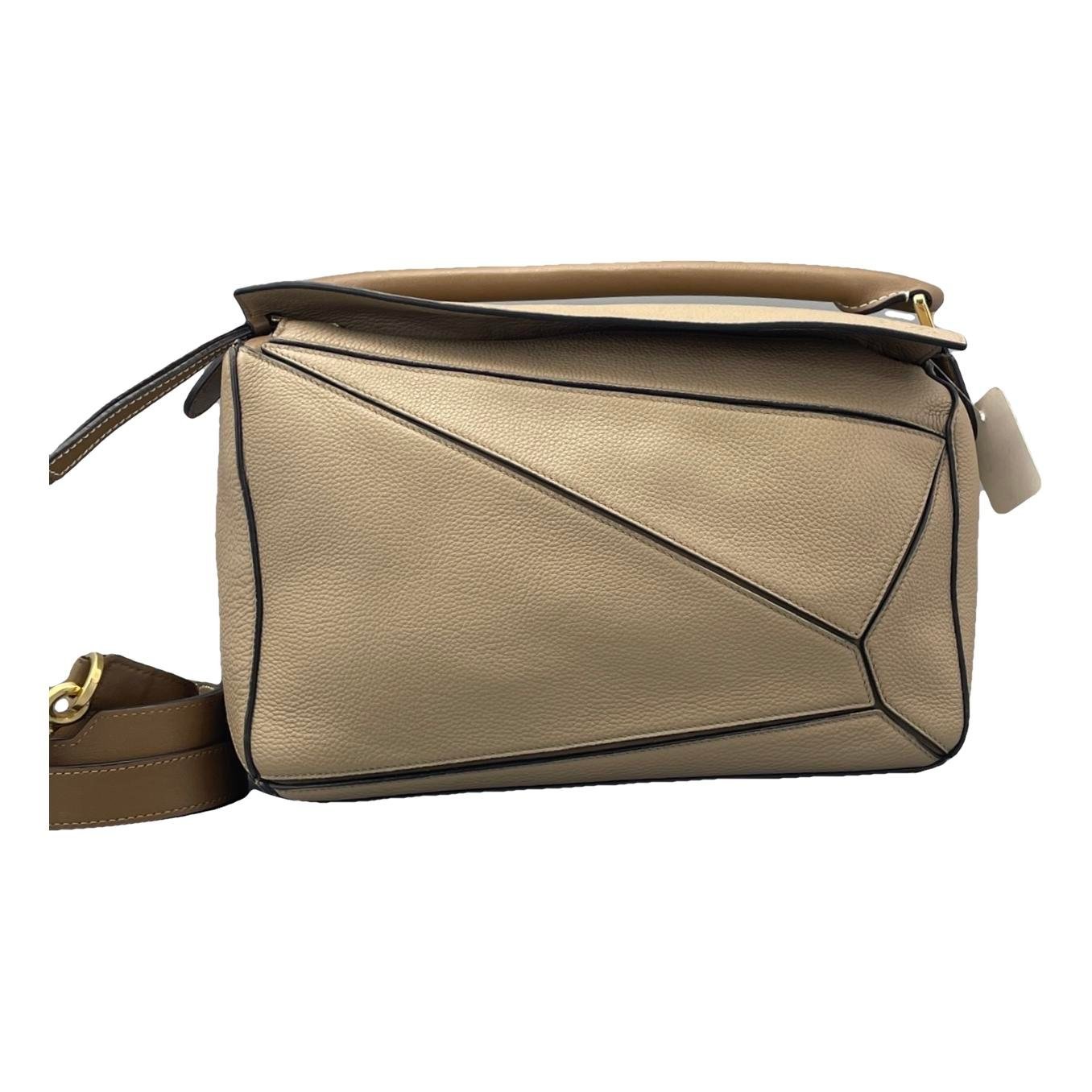 Puzzle leather handbag