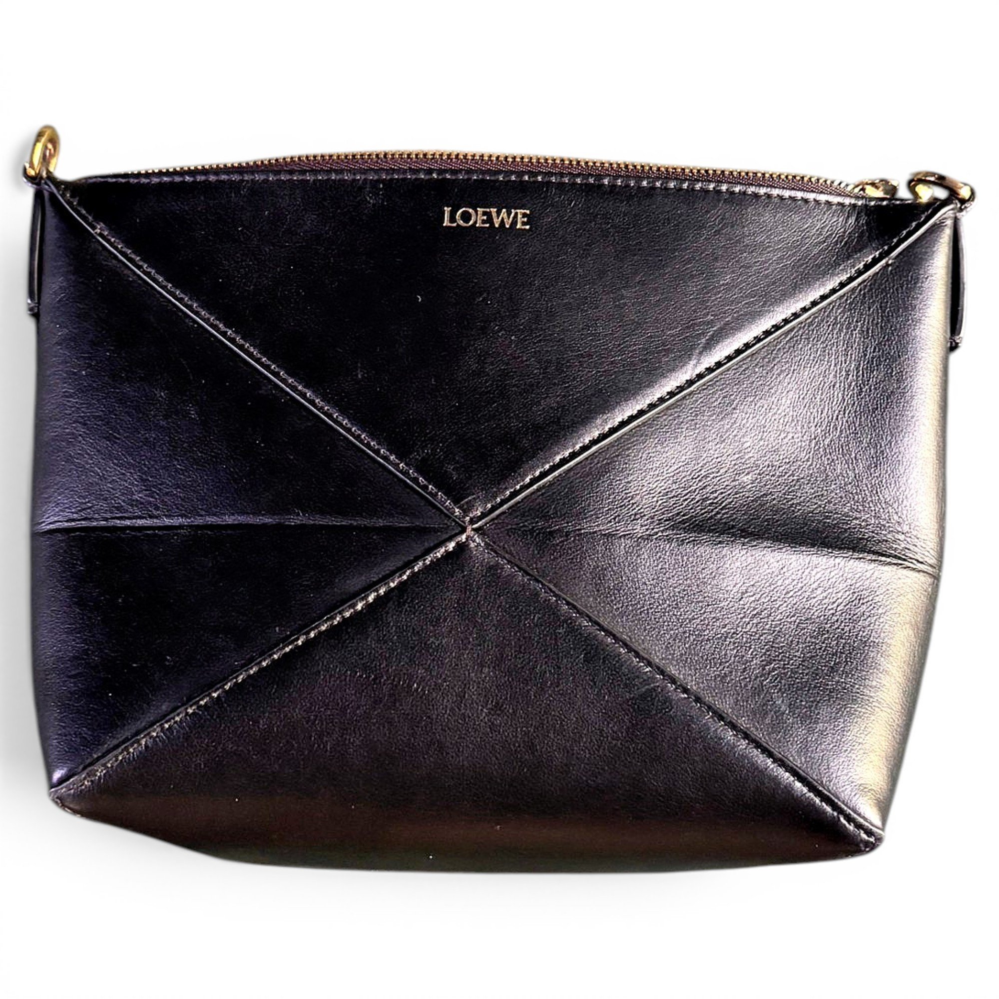 Puzzle leather clutch bag