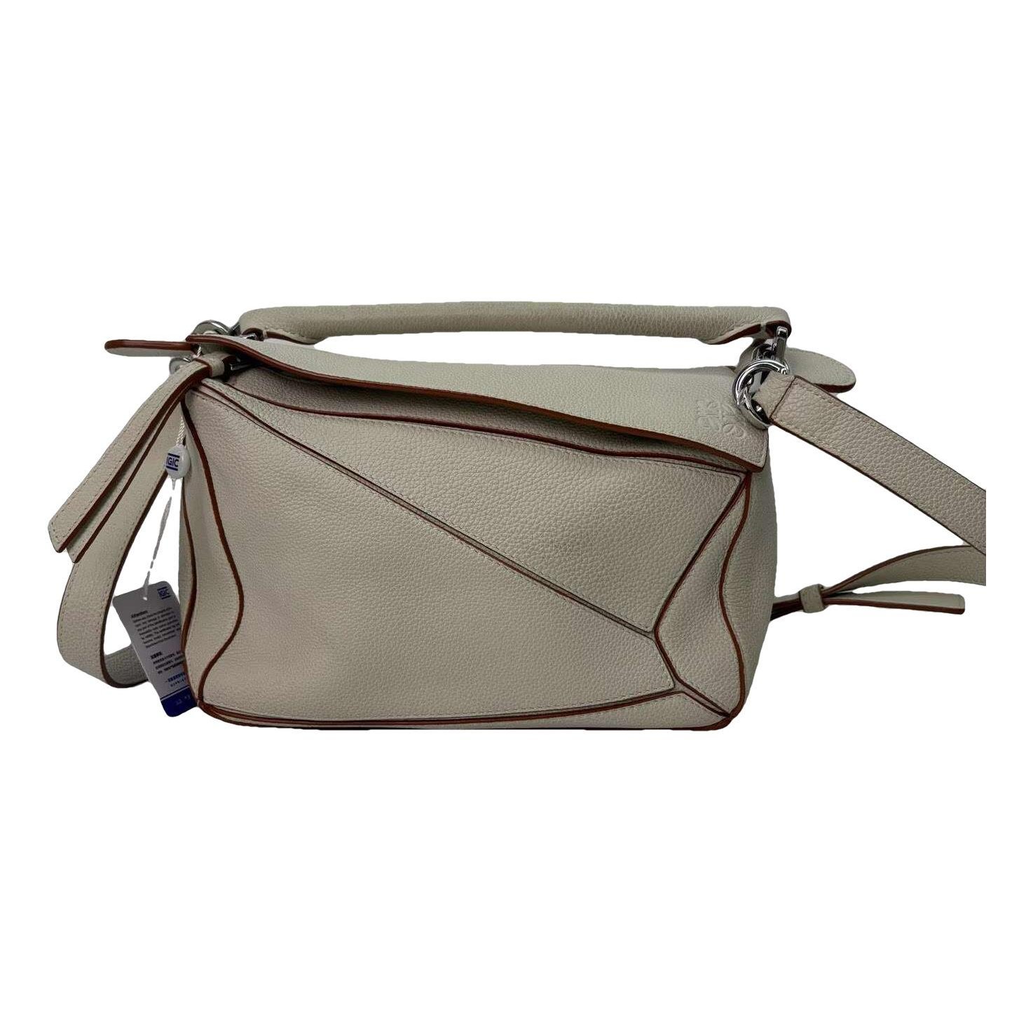 Puzzle leather handbag